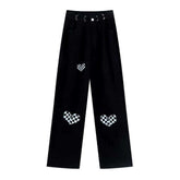 Vaqueros holgados negros con corazones pintados